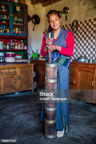 Tibetan Young Woman Preparing Butter Tea Upper Mustang Nepal Stock Photo - Download Image Now