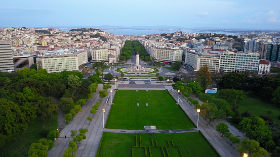 Aerial view of downtown and lisbon, along the most famous avenue in the capital. River Tagus in background