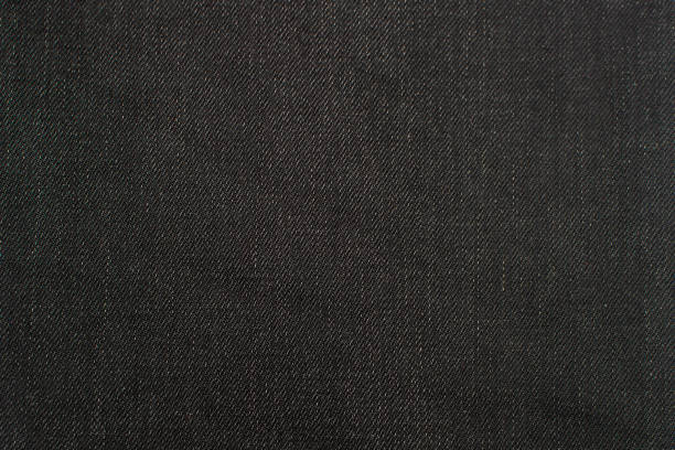 istock Close up black jeans denim texture. 1366681763