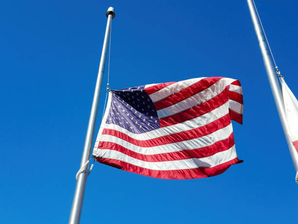istock American Flag Flying At Half Mast 1366683272