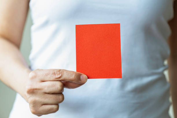 istock Woman holding Red Square Card 1366683423