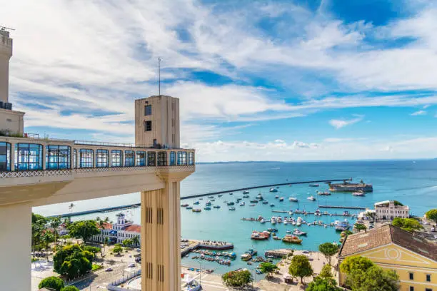 Elevador Lacerda (elevator) and Todos os Santos Bay on a sunny summer day at Salvador, Bahia. Historic architecture in Brazil