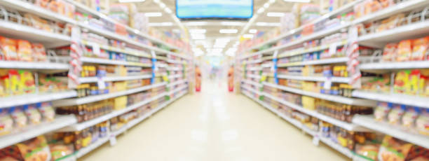 istock supermarket store aisle interior abstract blurred background 1366685455