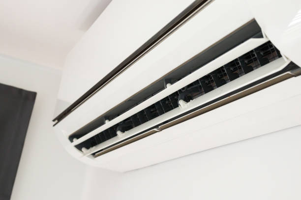 istock Air conditioner on white wall room interior background 1366685469
