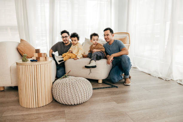 istock Same sex parenting - happy husbands 1366689869