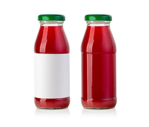 istock juice in glass bottle isolated 1366692024