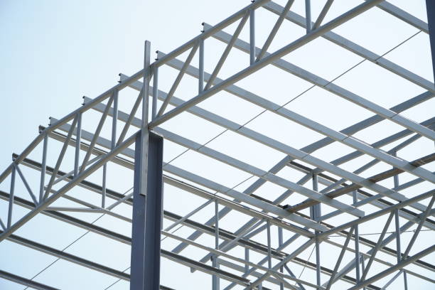 istock Structure of steel roof frame for building construction on sky background. 1366692230