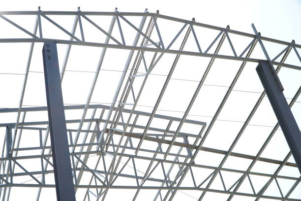 istock Structure of steel roof frame for building construction on sky background. 1366692241