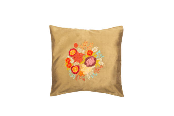 decorative, golden soft pillow with embroidered flowers, isolated on white background - pillow cushion embroidery homewares imagens e fotografias de stock