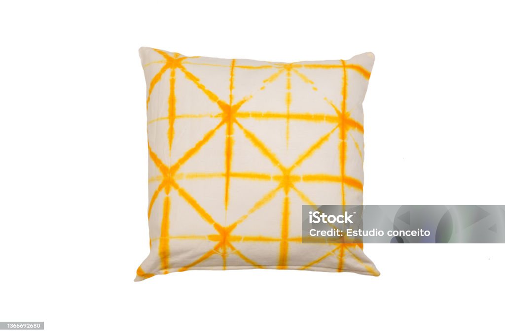 Decorative soft pillow, yellow tie dye pattern isolated on white background Cushion Stock Photo