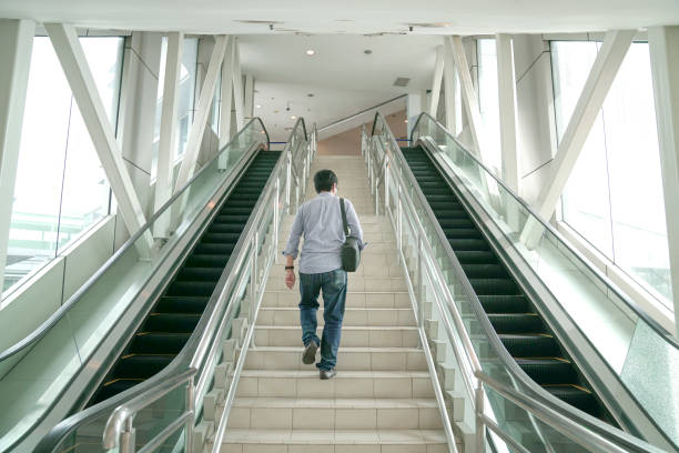 A young woman is happily shopping in a shopping mall.