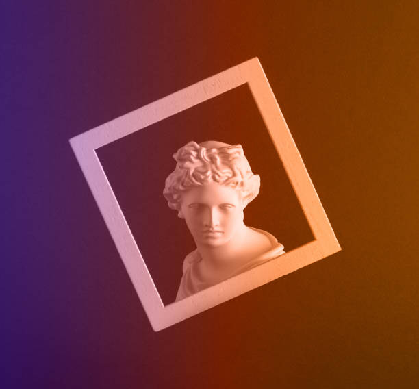 istock Tinted image of a clay figure in a frame on an abstract background. 1366699441