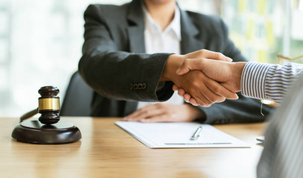 istock Businessman shaking hands discussing a contract agreement. 1366700509