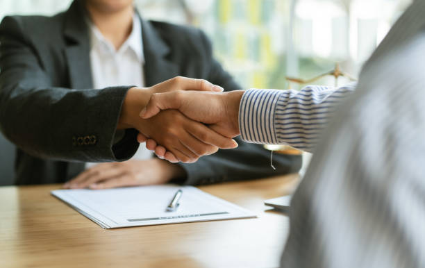istock Businessman shaking hands discussing a contract agreement. 1366701152