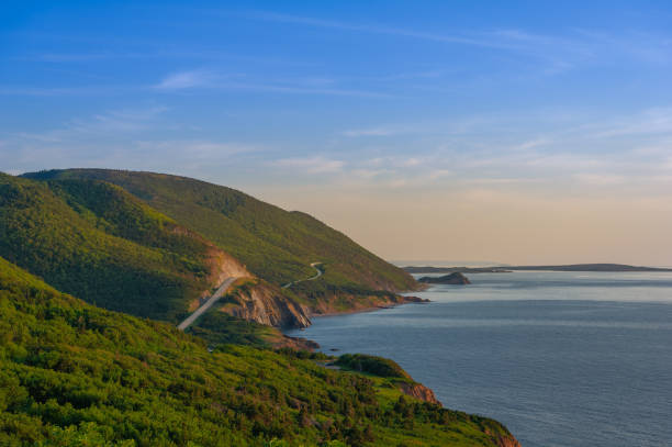 Cabot Trail in Cape Breton Highlands National Park West side of Cabot Trail in Cape Breton Highlands National Park, Nova Scotia, Canada during a summer sunset. cabot trail stock pictures, royalty-free photos & images