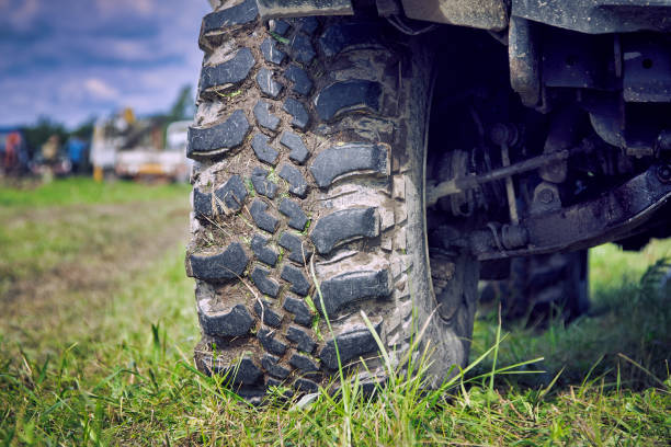 istock Suspension and dirty wheel tread on grass. 1366709041