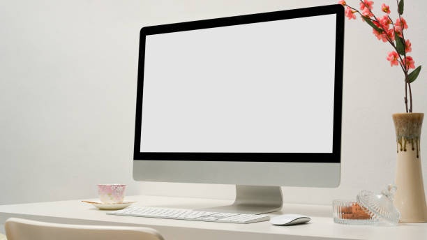 istock Close-up image, Modern office desk with pc desktop computer in white office room. 1366709953