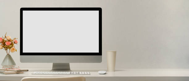 istock Feminine workspace or computer desk with pc desktop screen mockup 1366709958