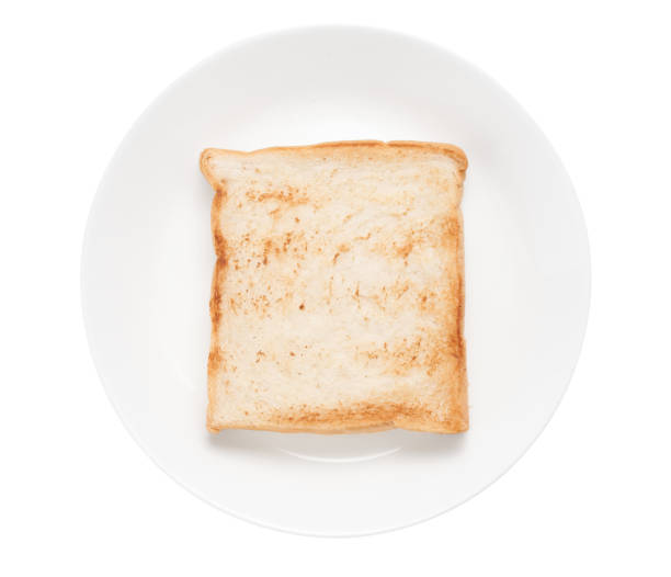 istock Slices toast bread in dish on white background 1366713260
