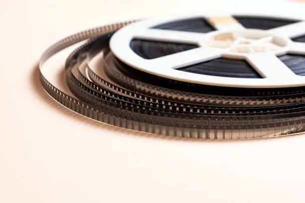 Old Film Reel on the Paper Background closeup