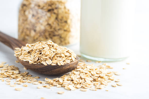 istock Uncooked oatmeal. Raw oat flakes. 1366717593