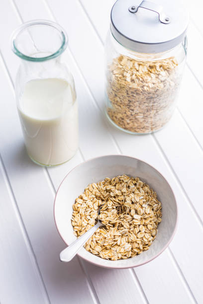istock Uncooked oatmeal. Raw oat flakes. 1366717636