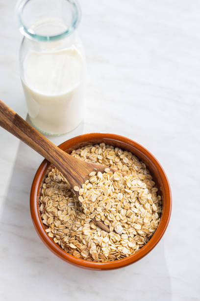 istock Uncooked oatmeal. Raw oat flakes. 1366717638