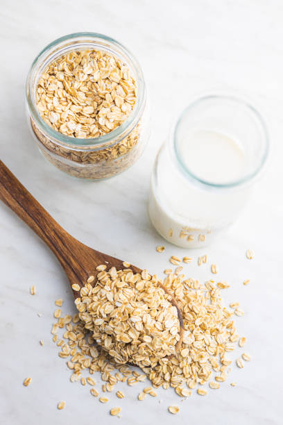 istock Uncooked oatmeal. Raw oat flakes. 1366717639
