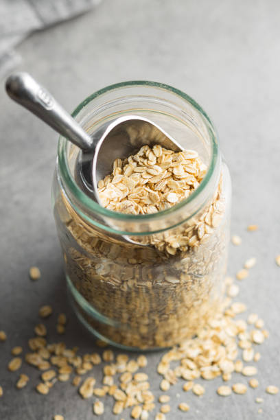 istock Uncooked oatmeal. Raw oat flakes. 1366717766