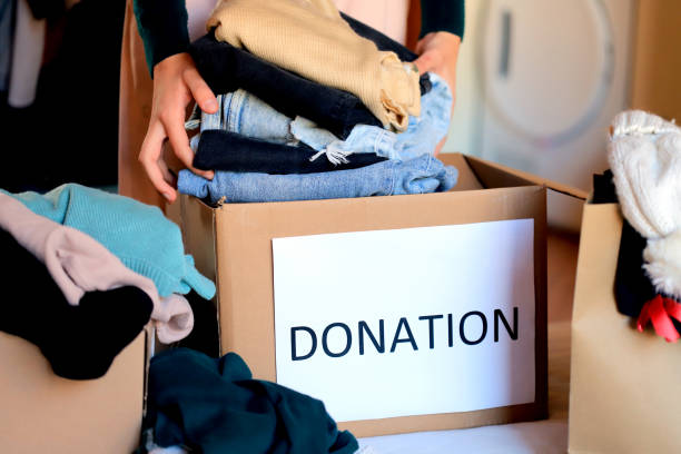 istock Girl donating clothes 1366722709