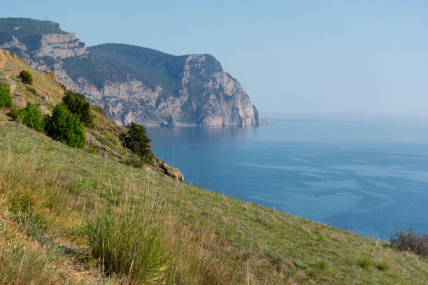 Rocky cliff landscape and beautiful cape with sunset over the sea