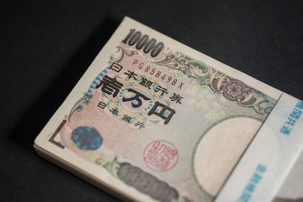 istock Japanese 1 million yen bill bundle on a black background 1366724969