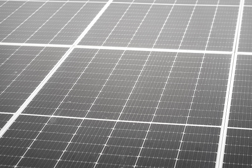 Electrical solar cell panels, clean energy technology and equipment object. Close-up for background and texture photo. Partial focus at solar cell surface.