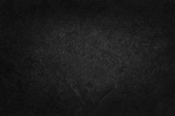 istock Dark gray black slate stone wall texture background in natural pattern for decorative interior and exterior. 1366728508