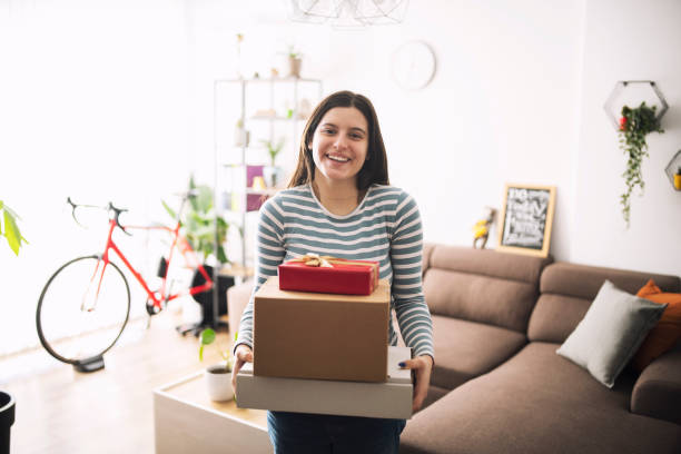 istock Smiling woman excited about her parcels. 1366730821