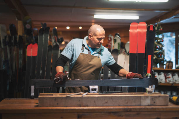 istock Ski technician repairing pair of ski. 1366730835