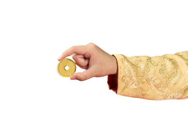 istock Hand holding golden Chinese coin 1366735694