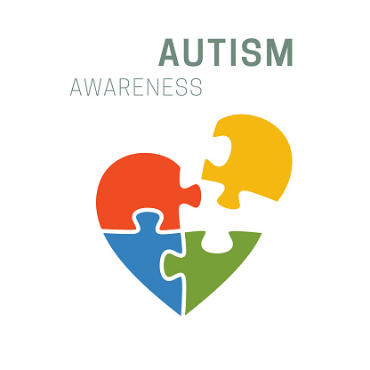 Autism awareness banner with colorful heart-shaped puzzle.