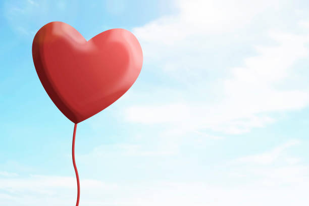 istock Heart hanging with a blue sky background 1366736603