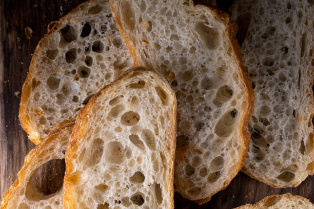 istock Sliced bread on a Board. On a wooden table. Top view 1366737824