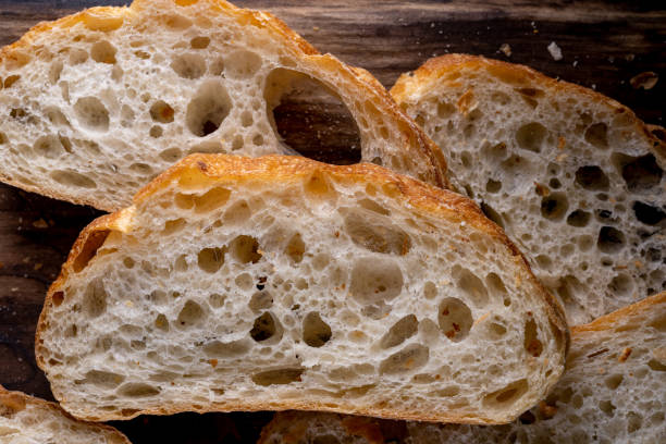 istock Sliced bread on a Board. On a wooden table. Top view 1366737892