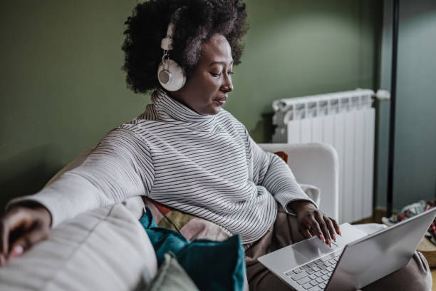 istock Relaxed and cozy work on laptop at home 1366739601
