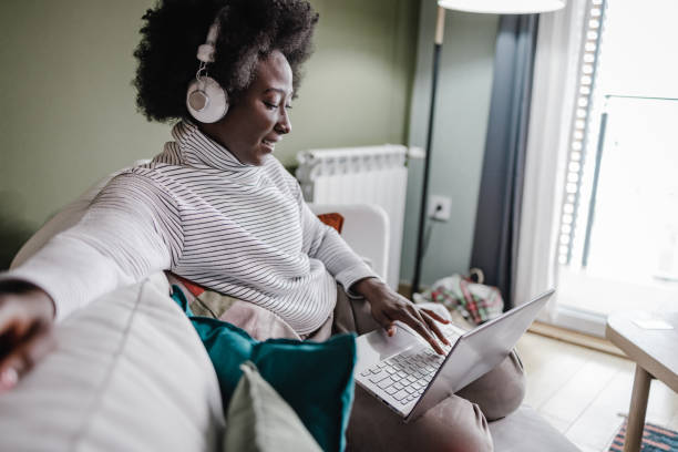 istock Relaxed and cozy work on laptop at home 1366741185