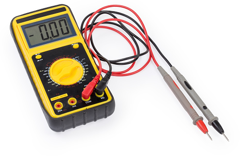 Modern portable handheld universal digital multimeter in protective rubber cover with connected test probes on a white background