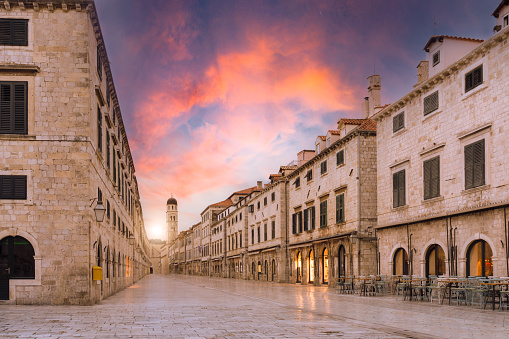 view of the main street in the old town of Dubrovnik city in Croatia at sunset\