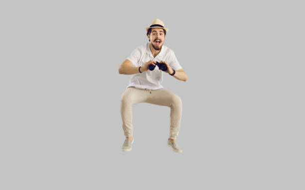 istock Shocked man tourist with great surprise on face jumping holding binocular 1366744249