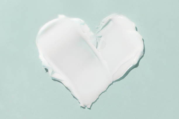 istock A smear of cosmetic cream on a blue background 1366745783