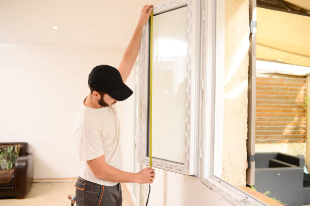 istock handsome young professional man installing and replacing a new home windows in client house for improvement energy saving efficiency isolation 1366748053