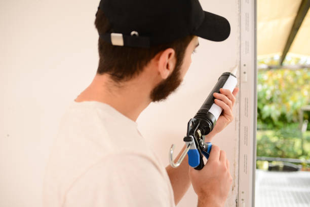 istock handsome young professional man installing and replacing a new home windows in client house for improvement energy saving efficiency isolation 1366748056
