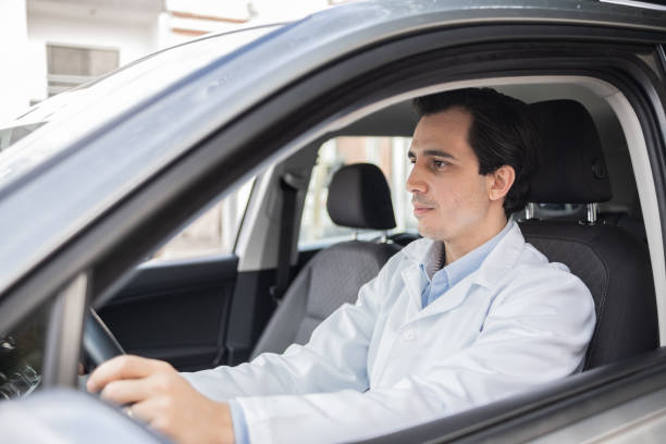 istock Latin doctor driving his car 1366748561